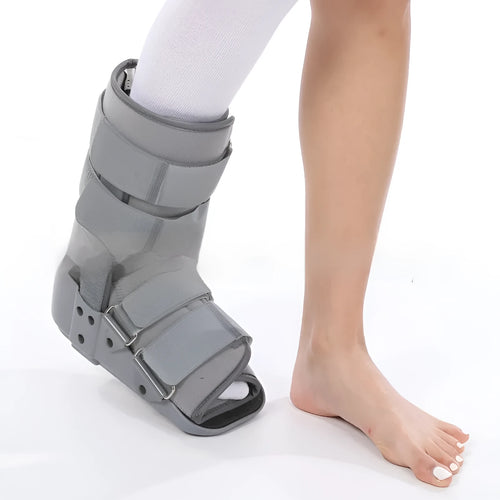 Achilles tendon rehabilitation walking boot in grey colour with adjustable strapping and rocker sole