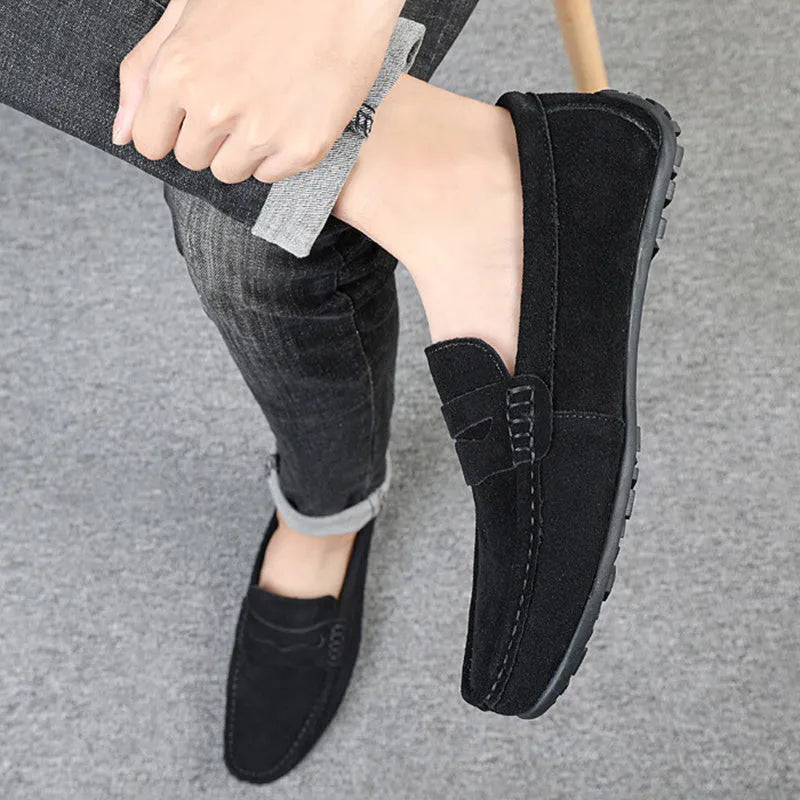 Men's solid colour suede loafers with slip-on design and round toe