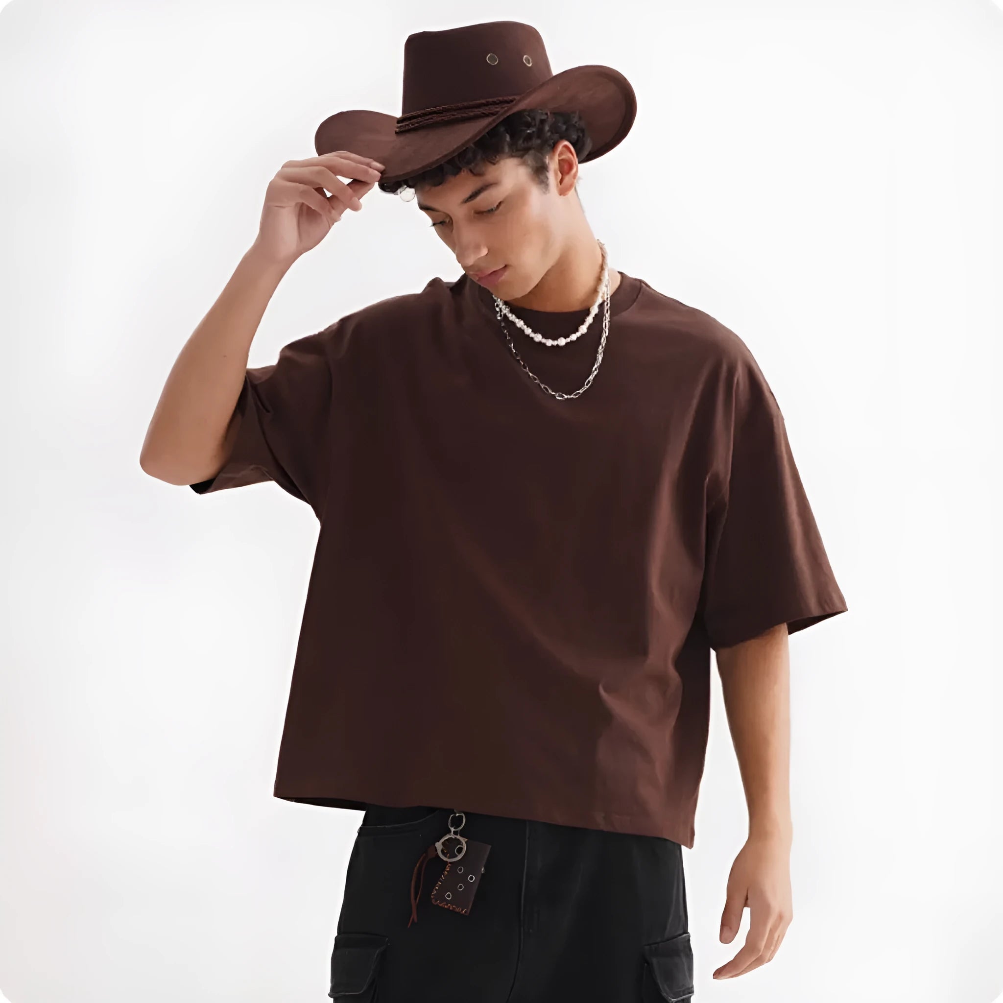 Pure cotton loose fit short sleeve t-shirt in apricot colour on a hanger.
