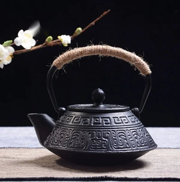 Japanese style cast iron teapot with traditional design and 0.9L capacity for tea brewing