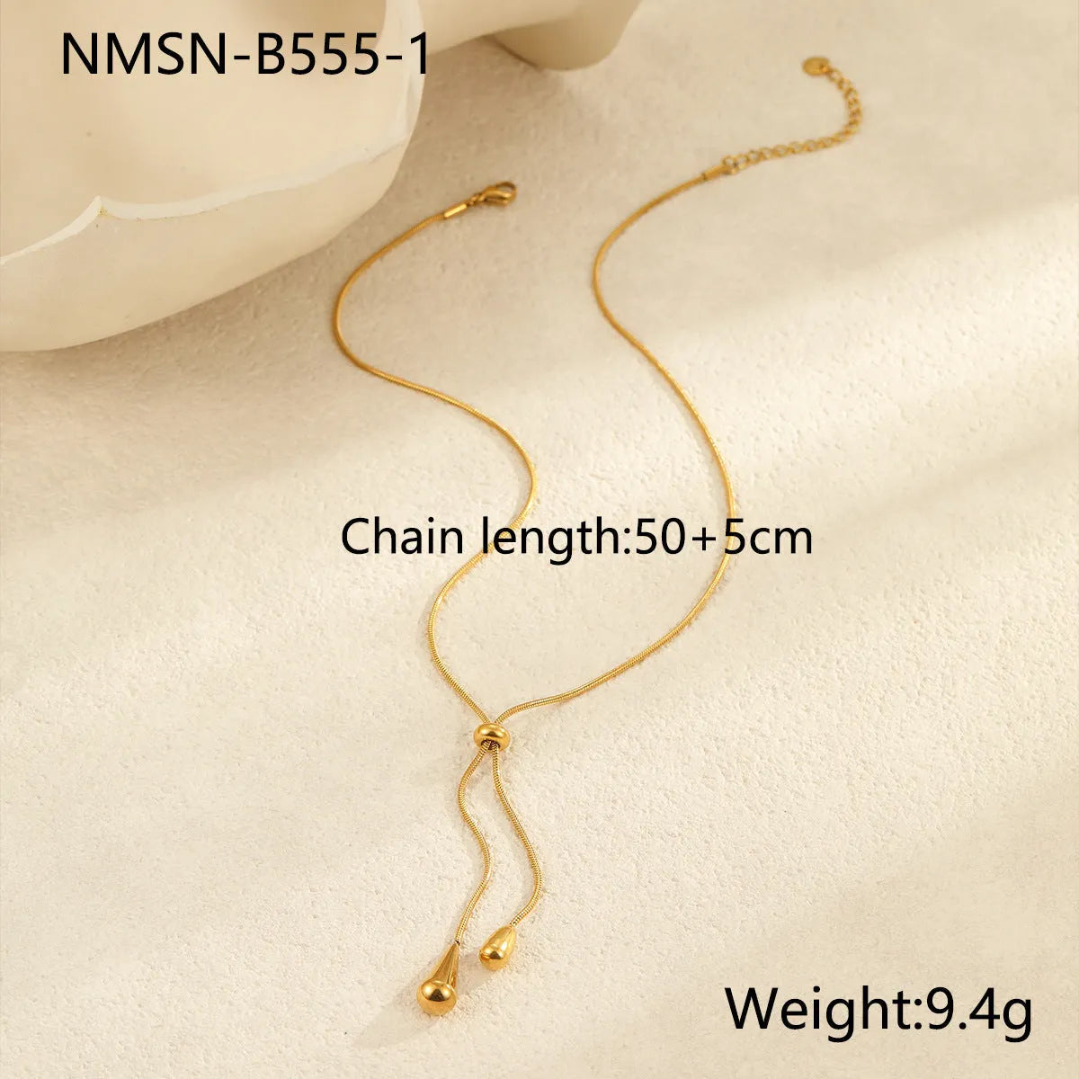 Stainless steel tassel water drop earrings with Y-word chain ornament in 18K gold electroplated finish, geometric drop-shaped design