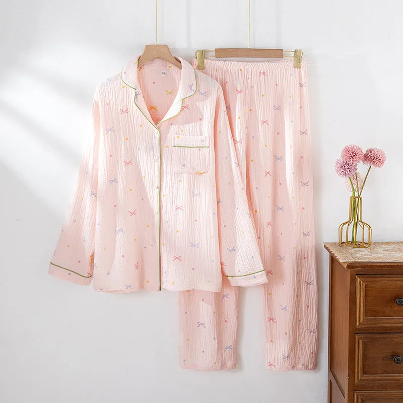 Women's beige thin cotton long-sleeved pajama top and trousers set laid flat