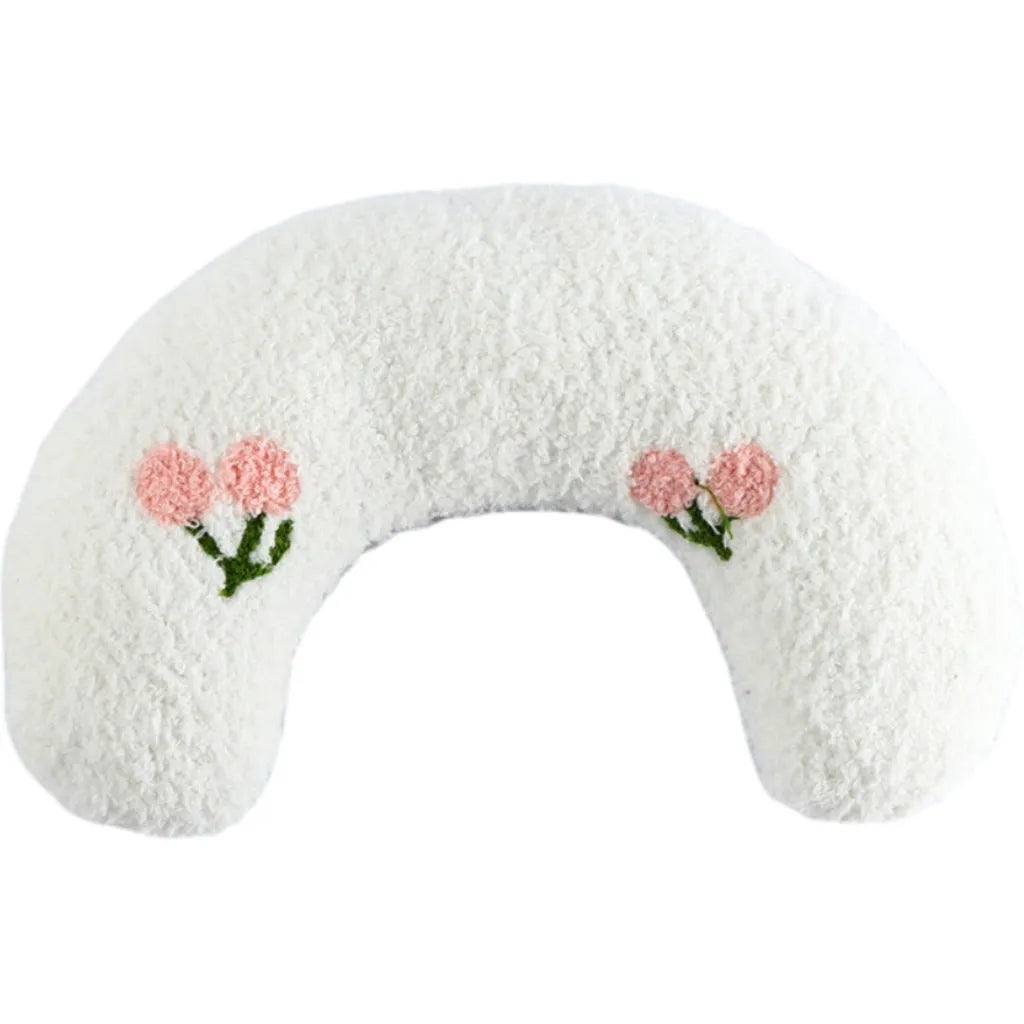 Small half-donut shaped plush pet pillow in blue, showing U-shaped design for cat or small dog neck support.