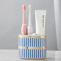 Ceramic toothbrush rack in household light luxury style with three colour options on a bathroom counter