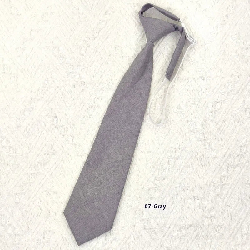 Navy blue cotton bow tie with arrow style design measuring 35cm by 7cm