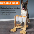 Wooden interactive dog puzzle feeder with treat compartments measuring 31cm long