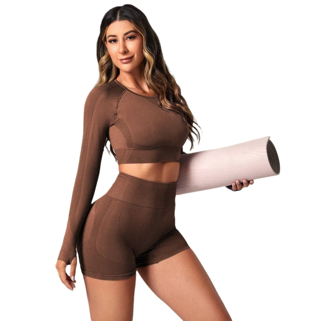 Women's black yoga clothes two-piece set showing long sleeve top and high-waist tight pants.