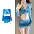 Women's blue four-piece bikini swimsuit set with high-waisted briefs, shirt, and skirt laid flat.