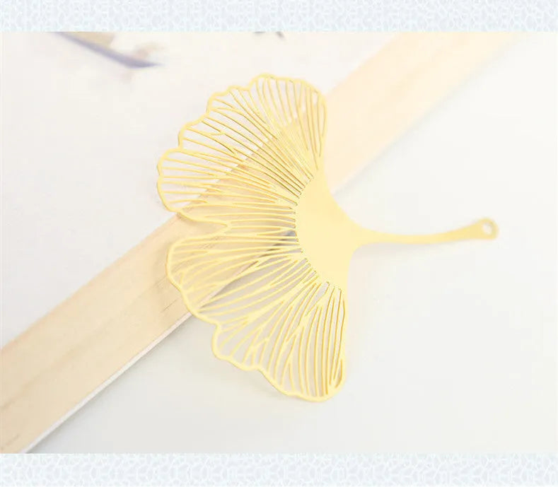 Brass bookmark with hollow-cut leaf design and matching rose gold metal tassel