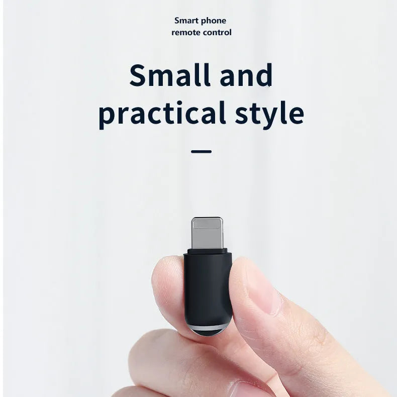 Black capsule infrared remote adapter with smartphone connectors measuring 34x11x11mm