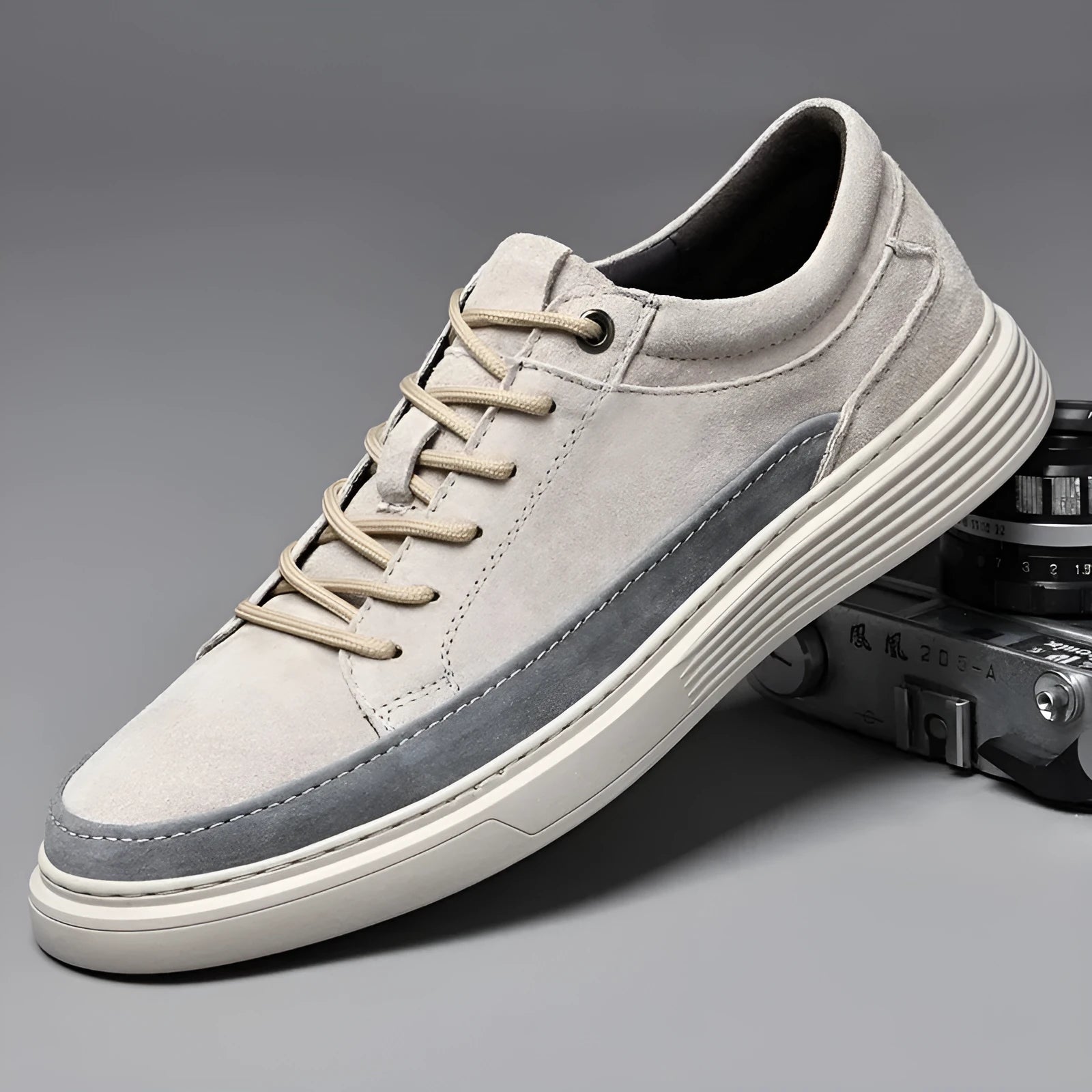 Men's grey pigskin leather casual skate shoes with flat rubber sole and lace-up front.