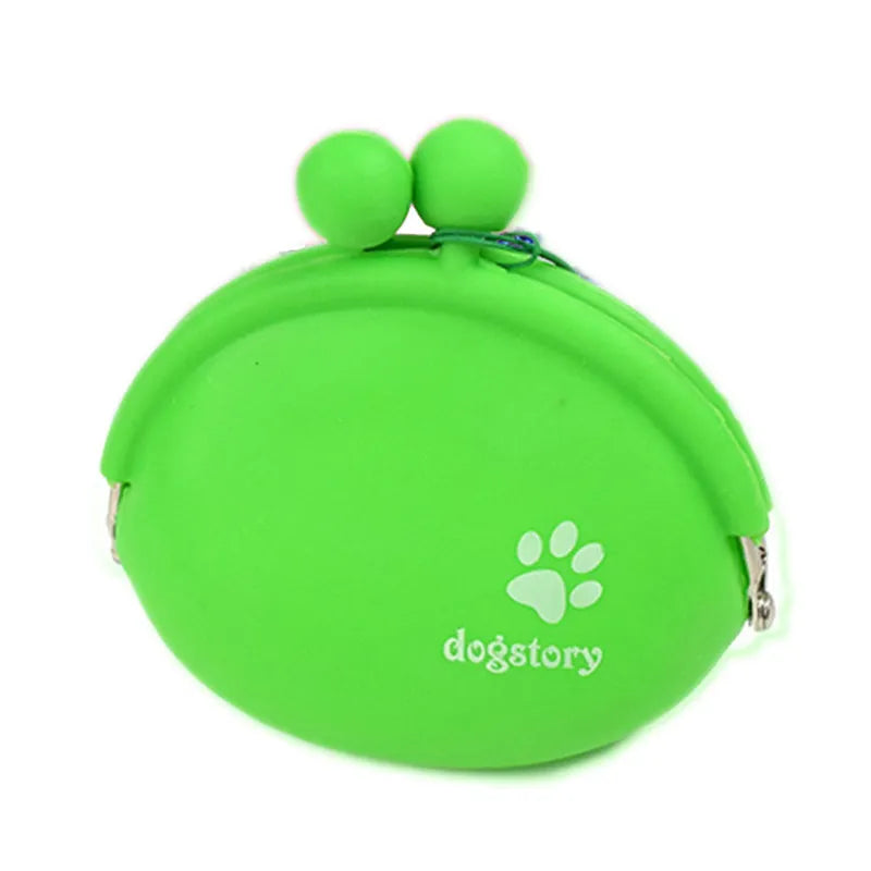 Yellow silicone dog treat pouch with hook and loop strap, shown on a waistband.