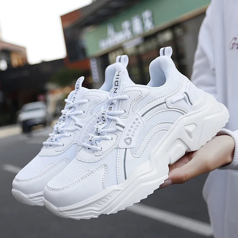 Women's white mesh casual sports shoes with thick PU sole, buckle detail, and a middle heel.