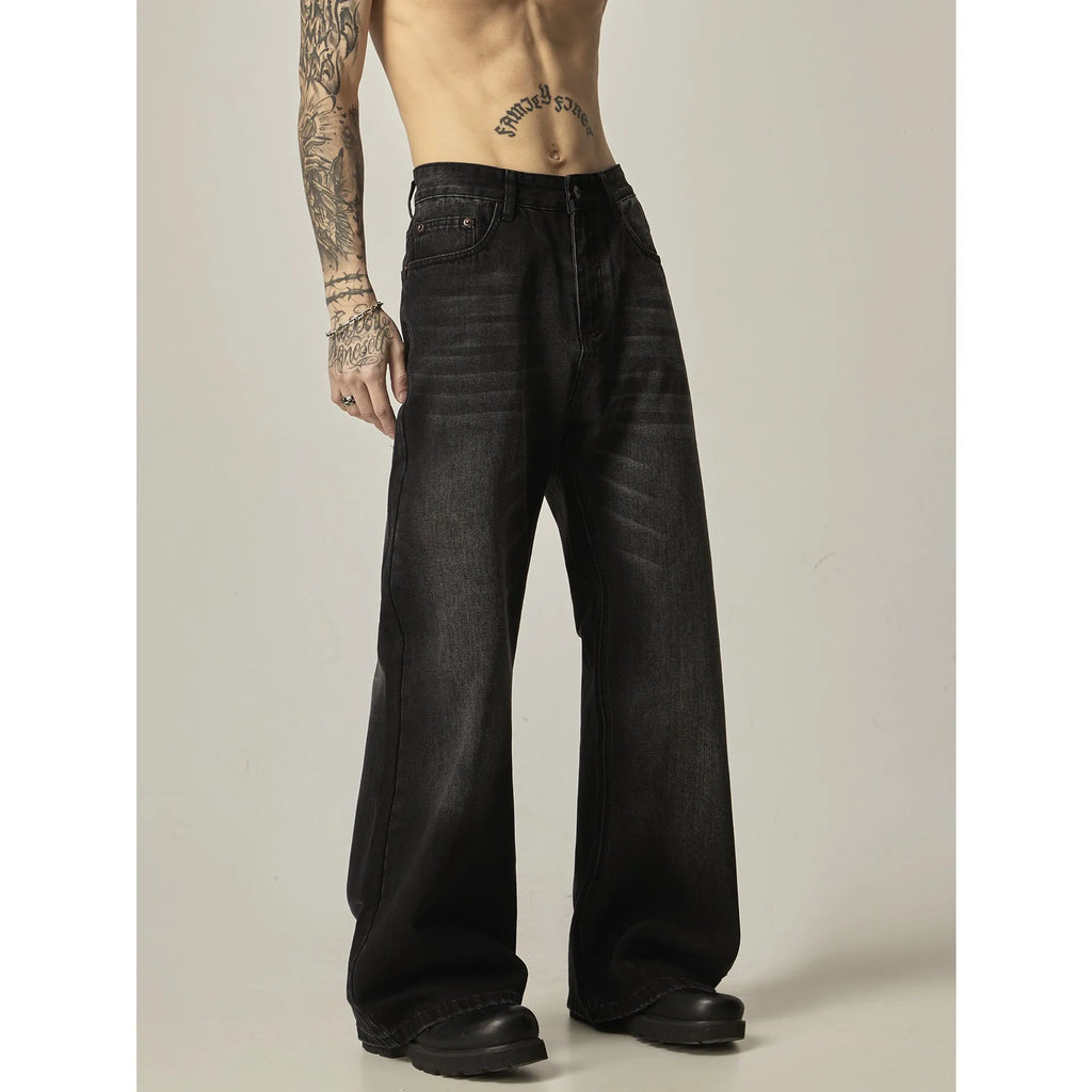 Black loose-fit straight-leg men's jeans with a zipper fly and retro styling.