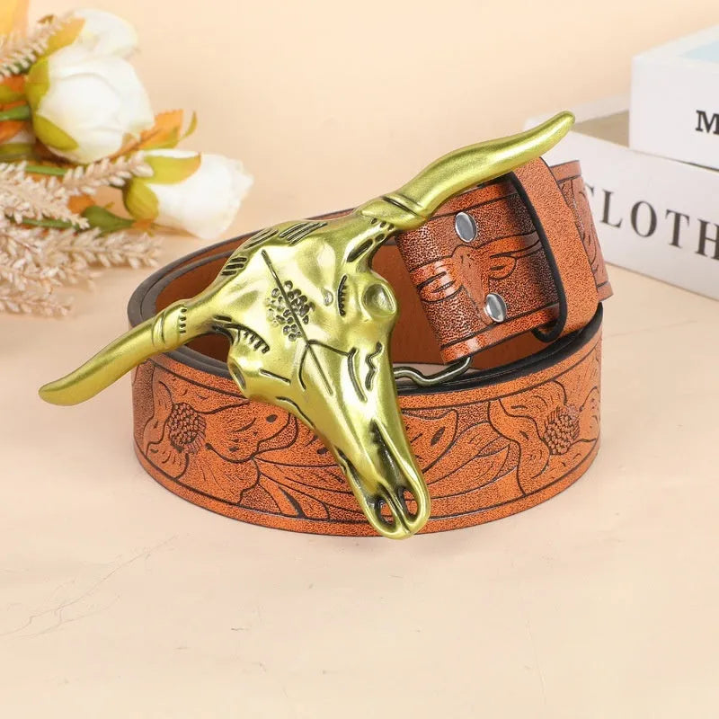 Cow head buckle men's imitation leather belt in black and brown colour options showing decorative alloy buckle detail