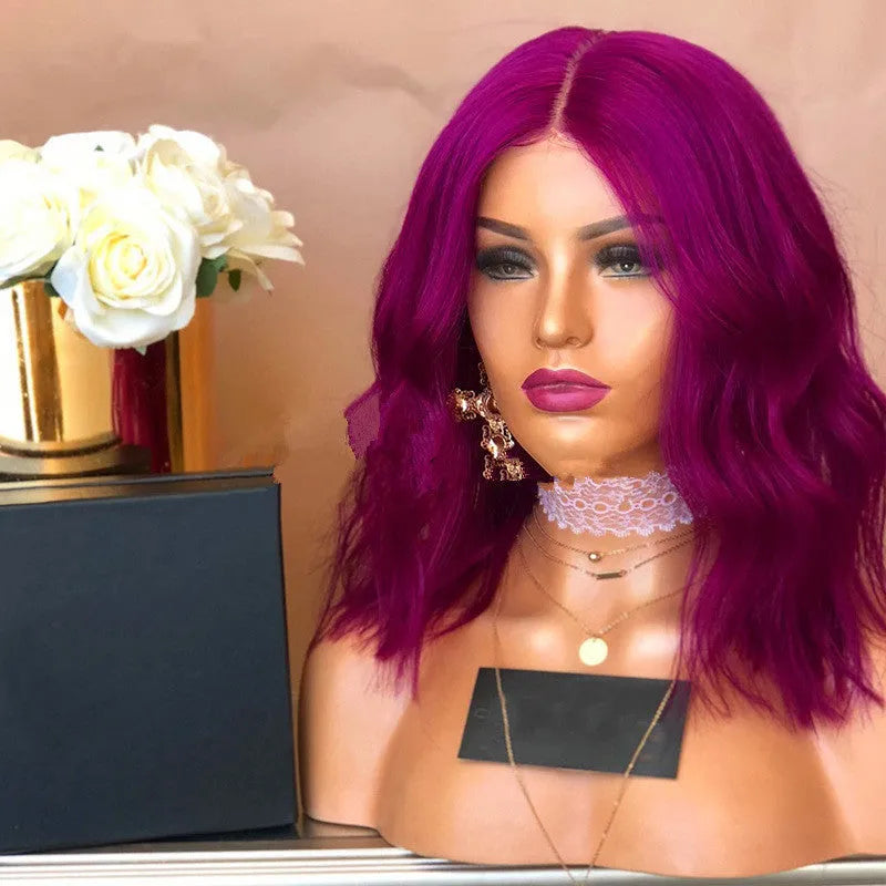 Women's medium to long curled hair wig in rose red with big wave curls, 45cm length, on display