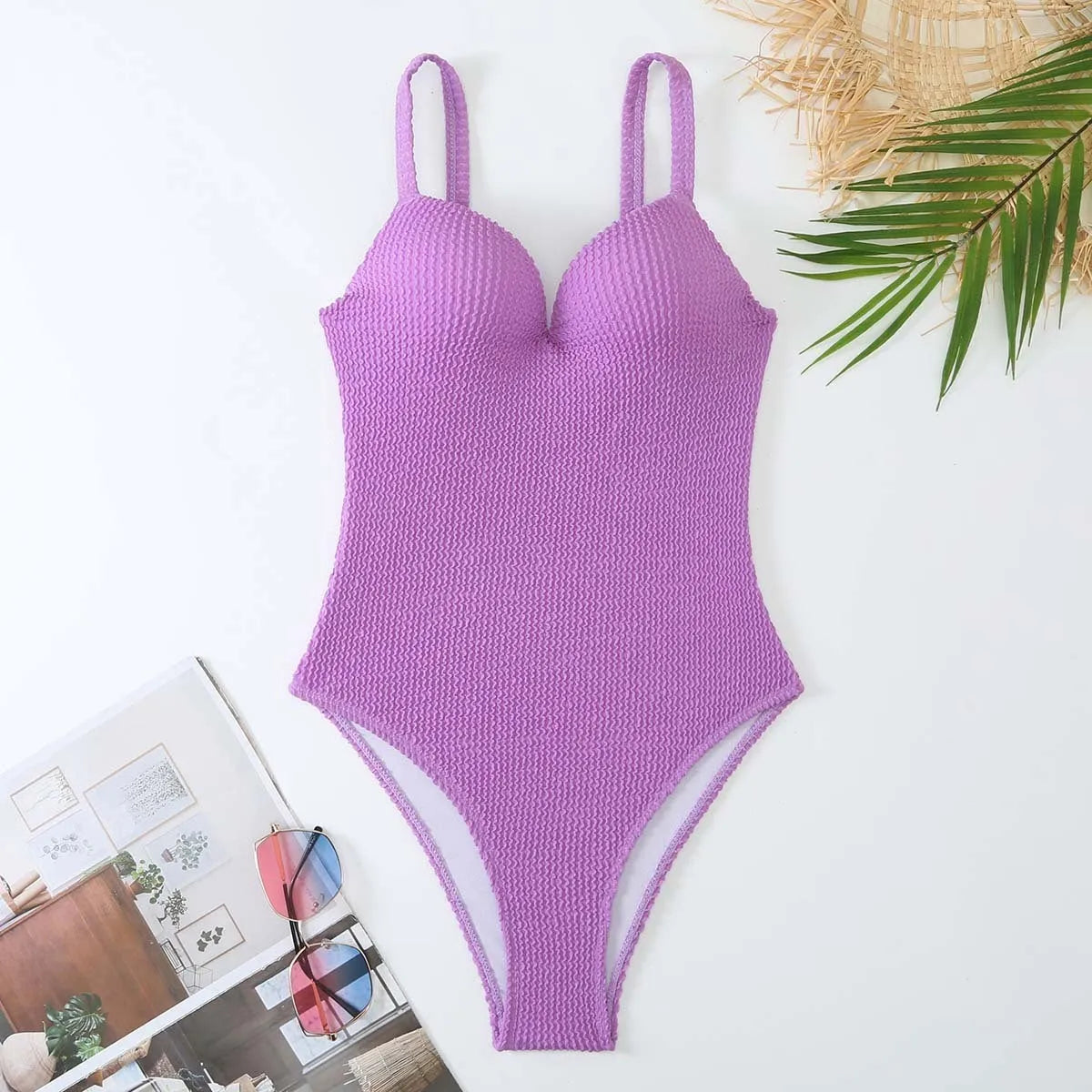 Women's black sunk stripe one-piece swimsuit made from polyester, shown on a mannequin.