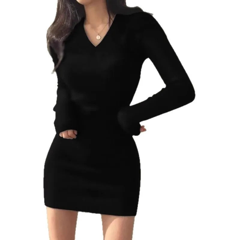 Front view of a black slim fit V-neck cotton hip skirt dress with long sleeves and elastic waist on a mannequin