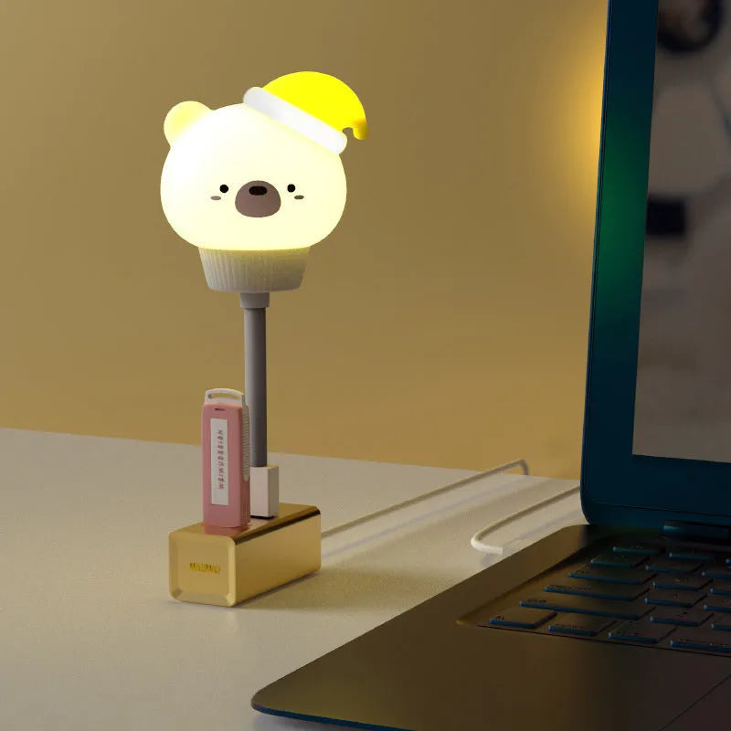 Cartoon animal USB night light with adjustable brightness on bedside table