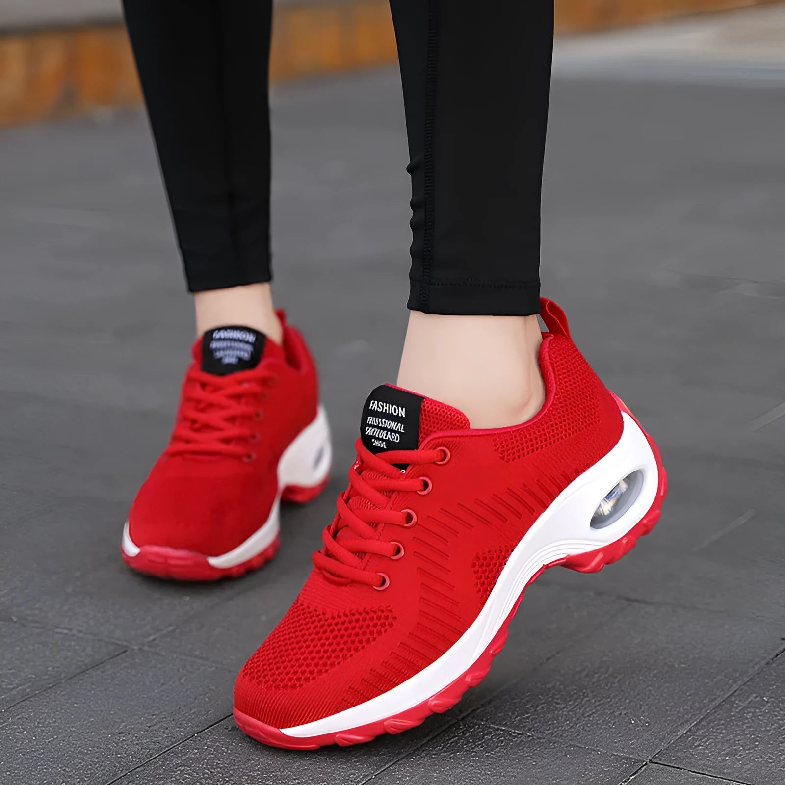 Women's red and black low top mesh sneakers with round toe and front lace-up design showing 3-5cm heel