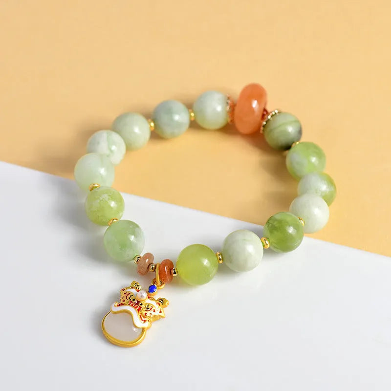 Green milk-in-water Xingshi jade geometric pendant on an adjustable string bracelet