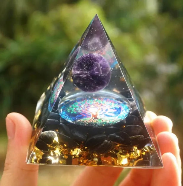 Clear epoxy resin pyramid ornament with embedded blue lapis lazuli crystal gravel, 6cm tall.