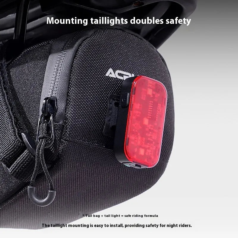 Bicycle waterproof rear bag with hanging taillight in black, 15x8x8cm capacity 1.5L, composite fabric, shows saddle attachment