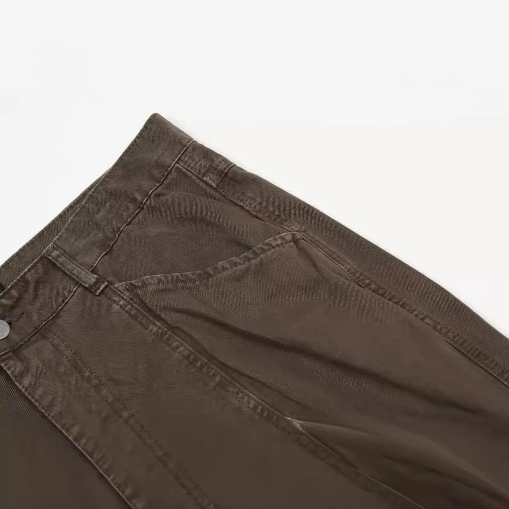 Men's brown loose straight leg trousers with high waist design and zip fly closure