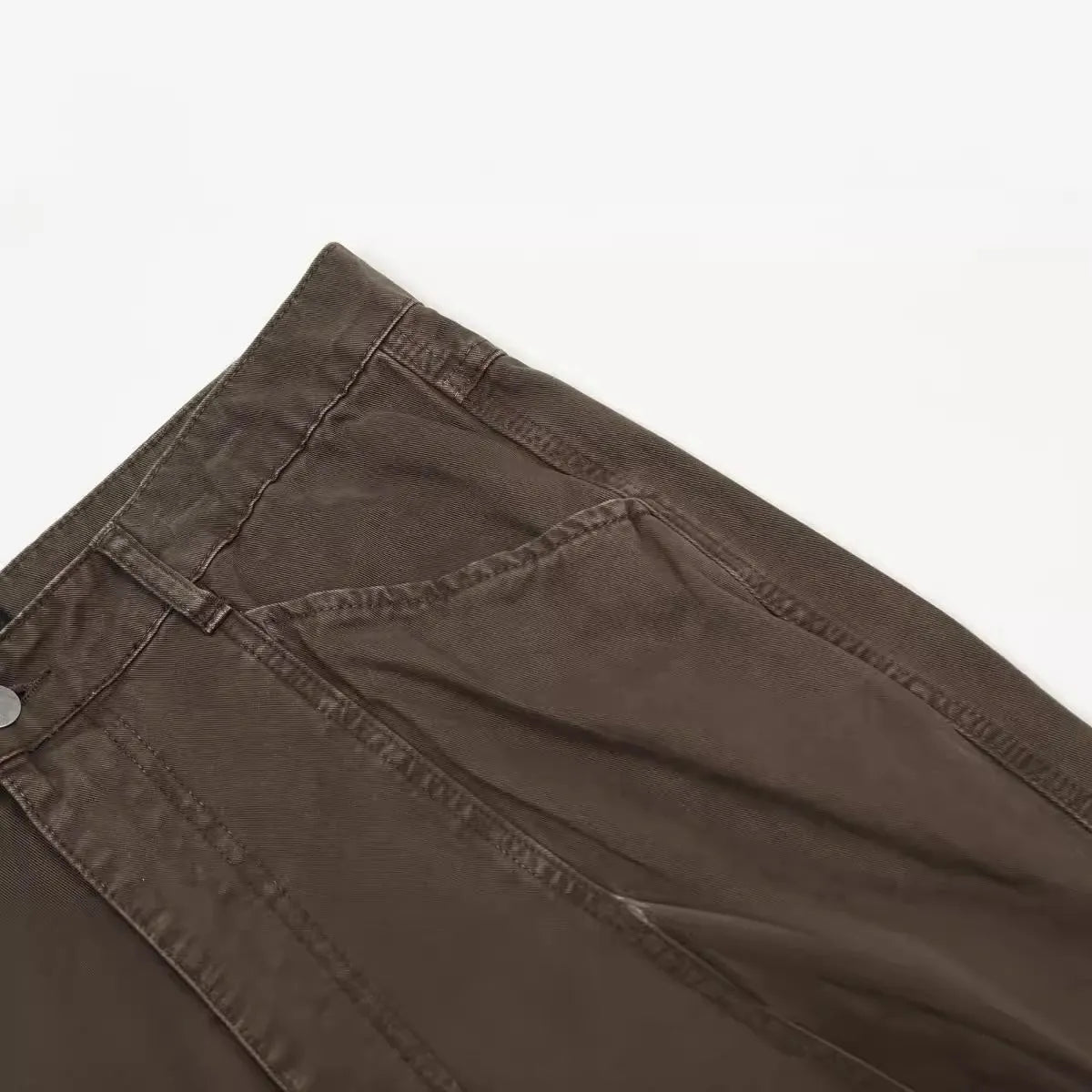 Men's brown loose straight leg trousers with high waist design and zip fly closure