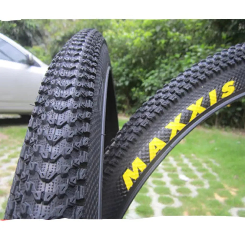 Ultralight puncture-proof mountain bike tyre shown in black with white label sidewall option.