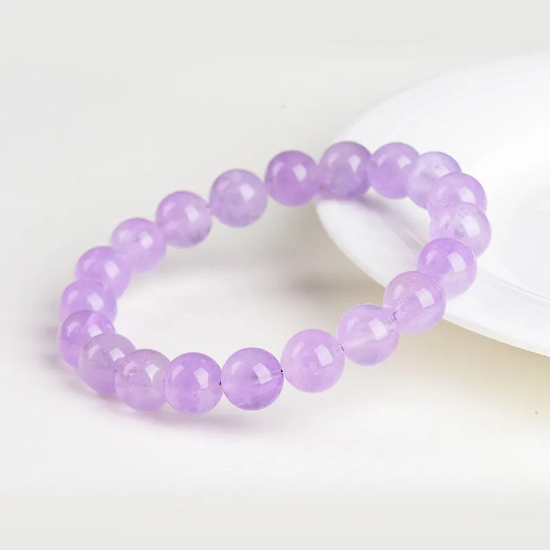 Lavender amethyst round bead bracelet with water ripple geometric pattern showing light purple crystal beads
