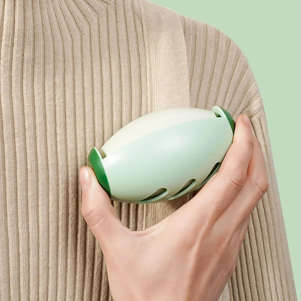 Washable reusable gel lint roller ball in green and white colours for pet hair removal