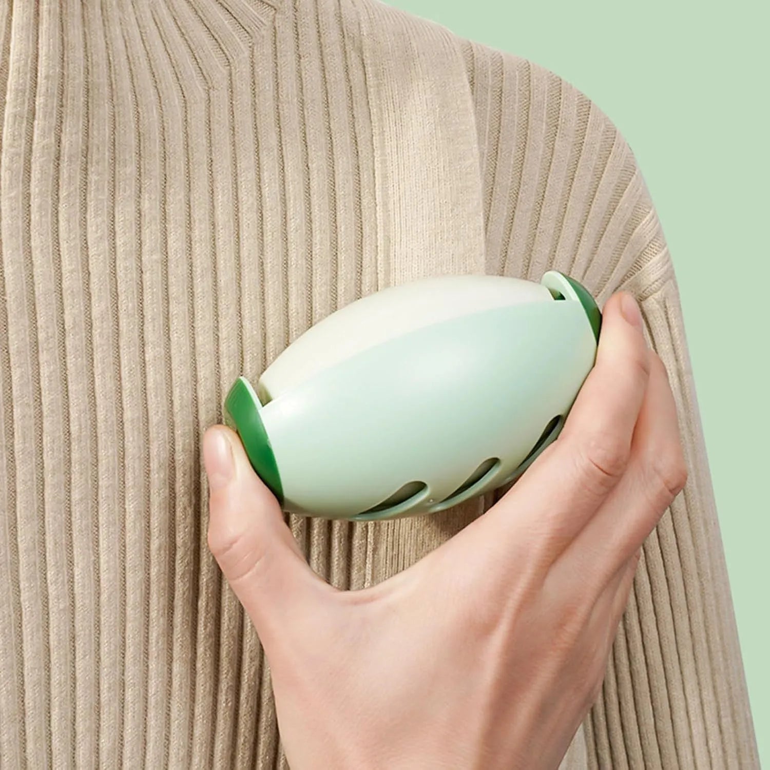 Washable reusable gel lint roller ball in green and white colours for pet hair removal