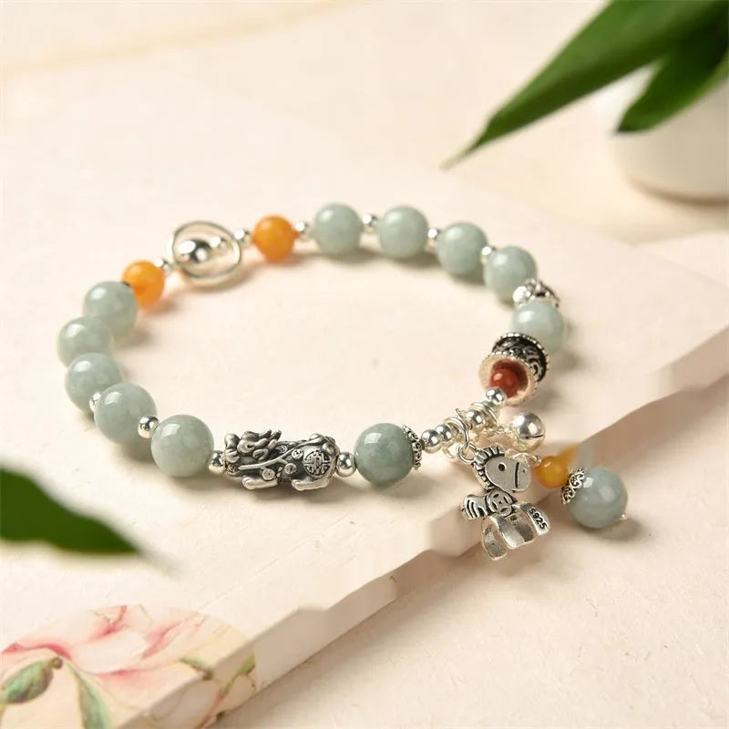 Natural emerald green vintage bracelet with jade stones on an alloy band, showing retro hand-crafted design.