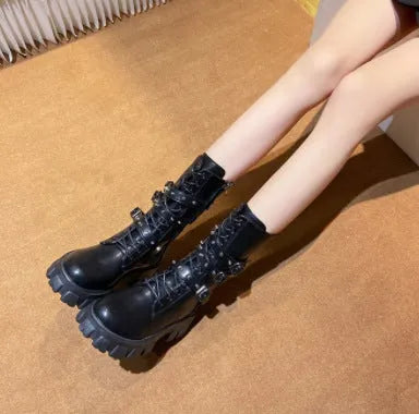 Women's black mid-calf knight boots with metal buckle detailing and side zipper closure