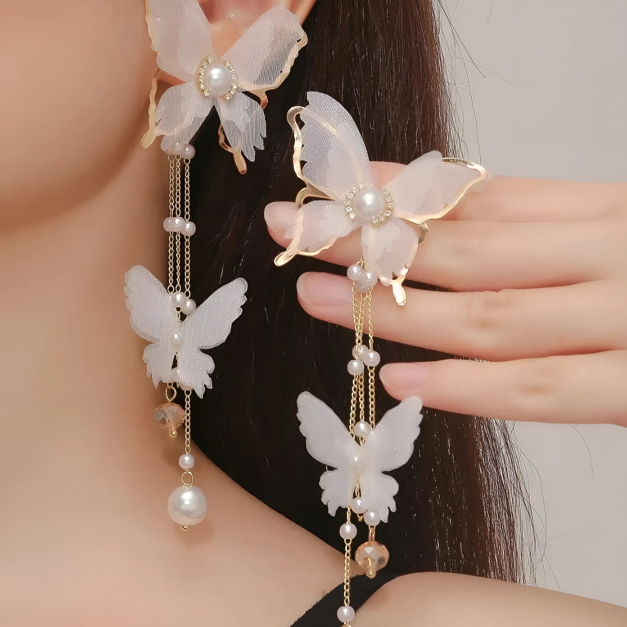 White butterfly earrings with tassel lace pearl rhinestone design on copper alloy