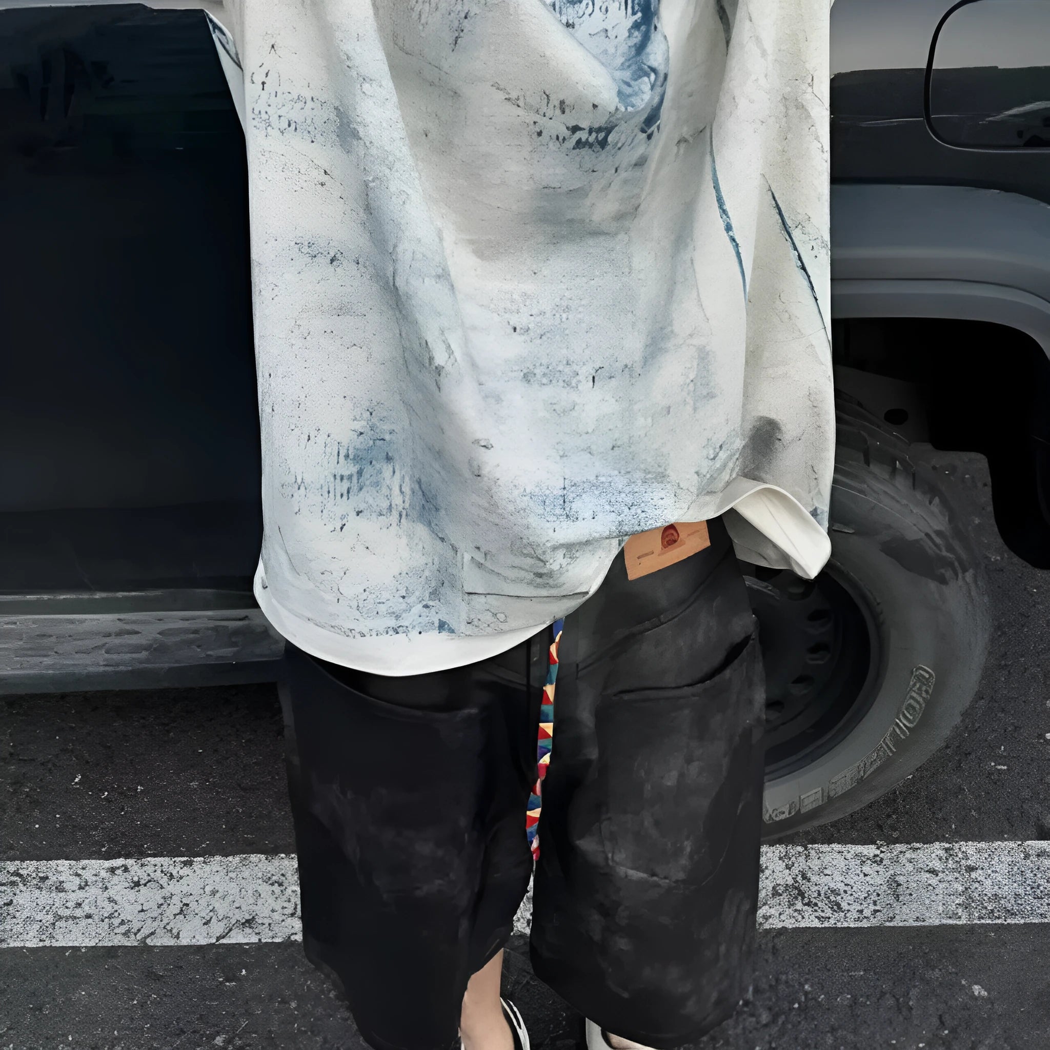 Korean-style loose fit T-shirt with distressed summer wash and tie dye print on solid colour polyester.