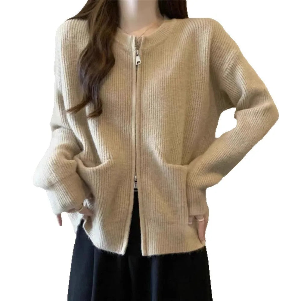 Beige women's long sleeve soft glutinous sweater coat cardigan laid flat.