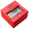 Red wired break glass emergency fire alarm button on white background