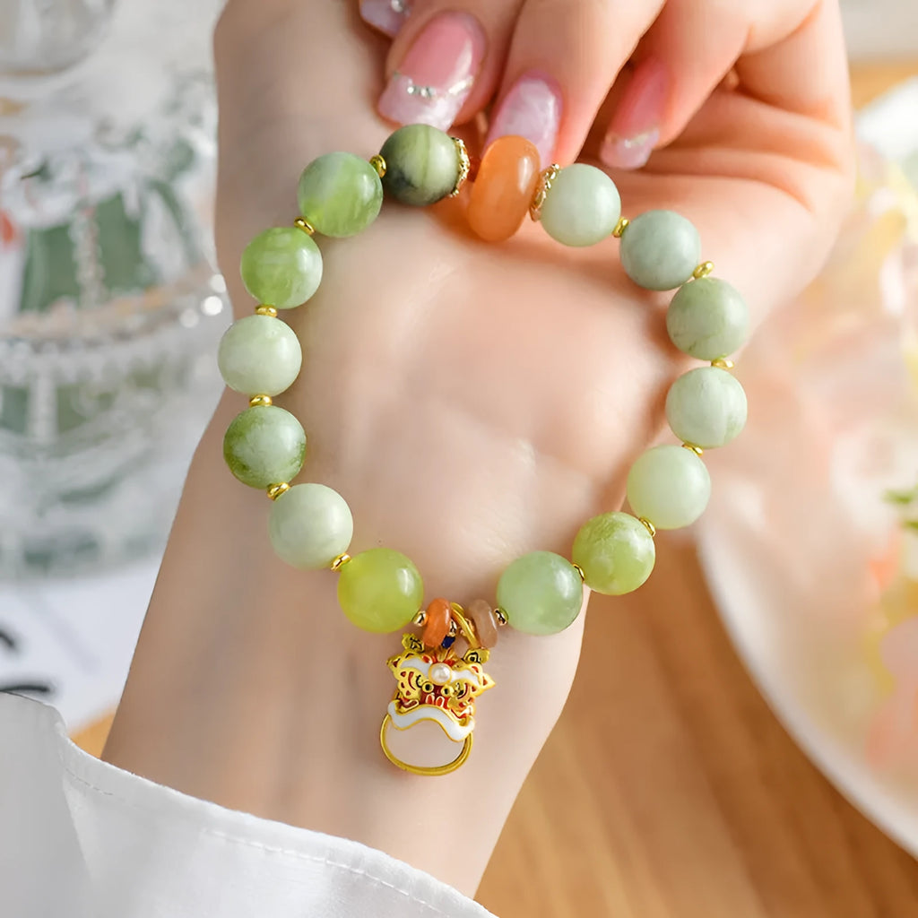 Green milk-in-water Xingshi jade geometric pendant on an adjustable string bracelet