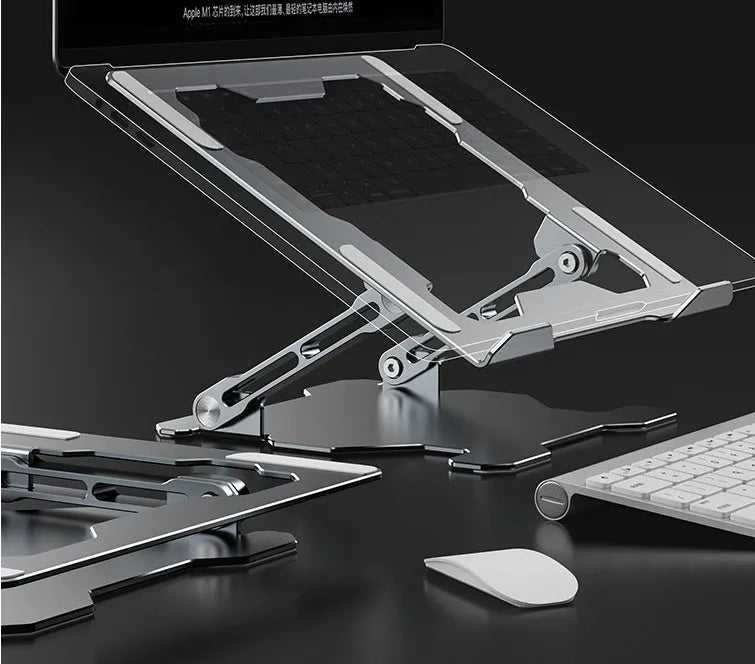 Grey aluminum folding laptop stand shown at an adjustable angle holding a silver laptop.