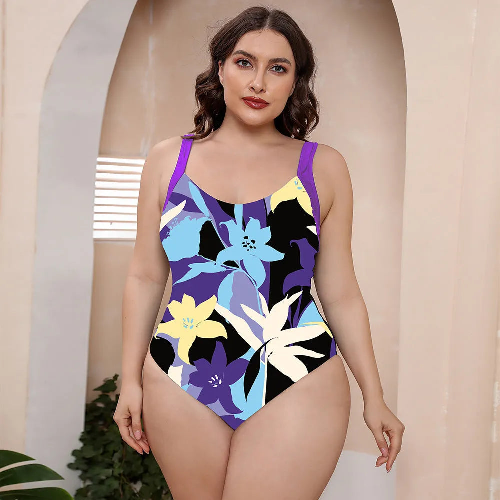 Floral print one-piece swimsuit with spaghetti straps and a conservative vest-style top.
