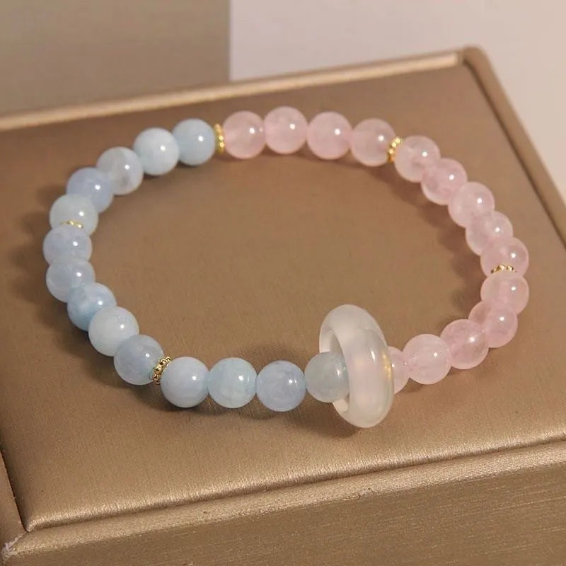 Women's aquamarine crystal bracelet with pink and blue dopamine colours, round geometric beads, handcrafted mixed materials