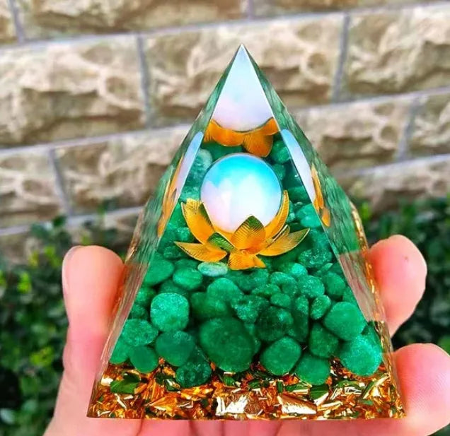 Clear epoxy resin pyramid ornament with embedded blue lapis lazuli crystal gravel, 6cm tall.