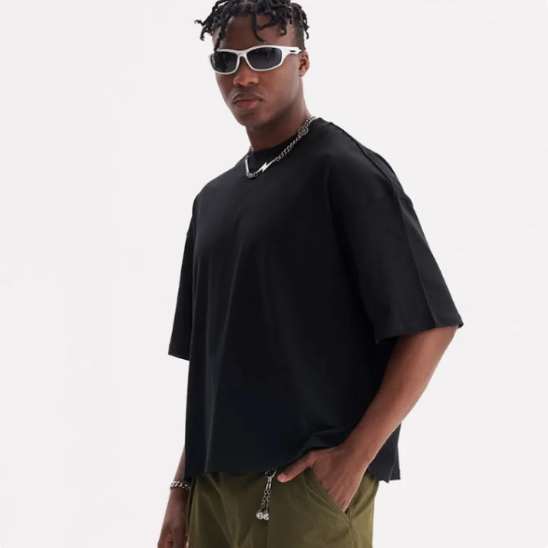 Pure cotton loose fit short sleeve t-shirt in apricot colour on a hanger.