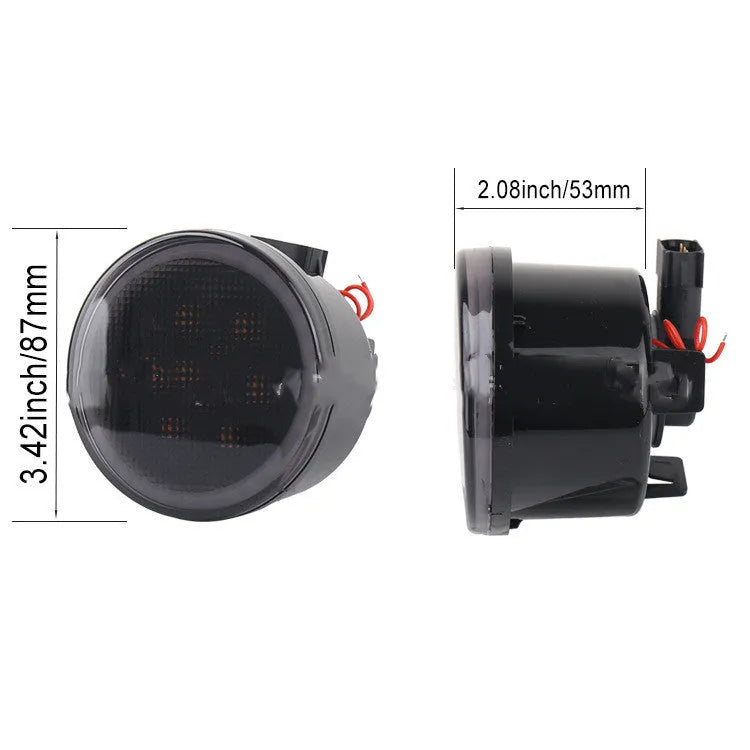Pair of yellow LED turn signal lights mounted in Jeep Wrangler JK centre grille with ABS polymer housing