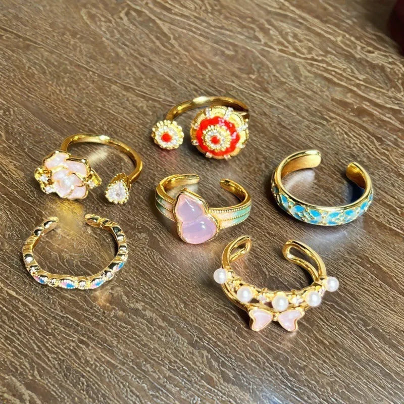 Adjustable copper ring with vintage oil dripping gourd design, zircon inlay, and floral bow shapes in New Chinese style.
