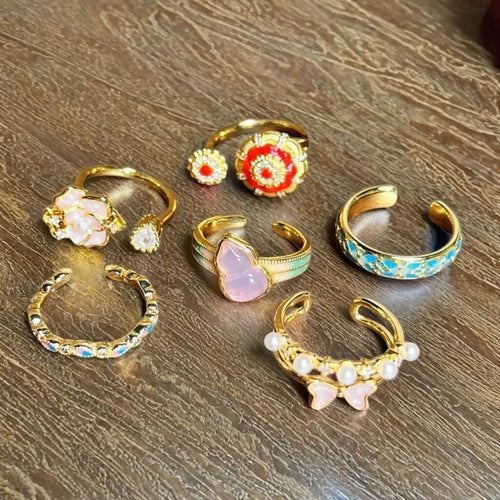 Adjustable copper ring with vintage oil dripping gourd design, zircon inlay, and floral bow shapes in New Chinese style.