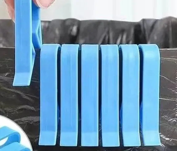 White PP plastic side-fixed clip for holding a bin bag on a trash can rim.