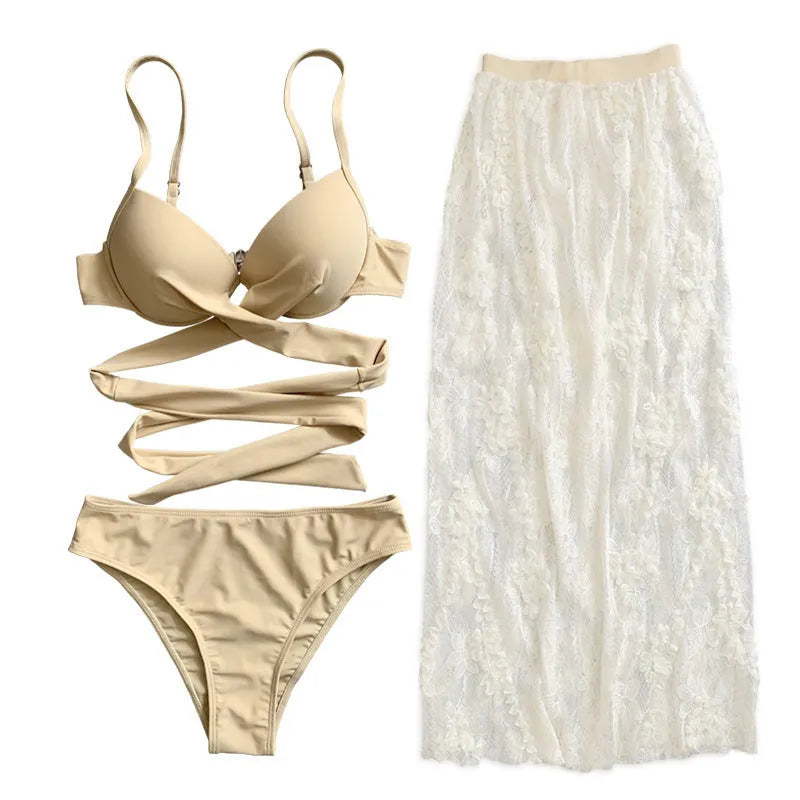 Women's creamy white three-piece bikini set with backless push up top, briefs, and skirt on a mannequin.